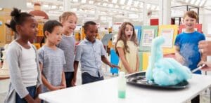 Kids,Having,Fun,Watching,An,Experiment,At,A,Science,Centre