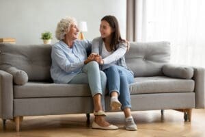 Happy,Adult,Granddaughter,And,Senior,Grandmother,Having,Fun,Enjoying,Talk