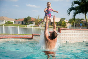 Father,And,Daughter,Having,Fun,In,Pool