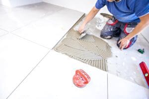 Laying,Tiles,At,Home.,Construction,Worker,Laid,Floor,Tiles.