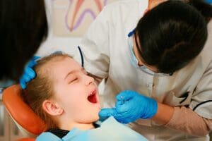 Close,Up,Of,Little,Patient,Lying,On,Chair,With,Open