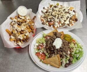 own a thriving Greek eatery,