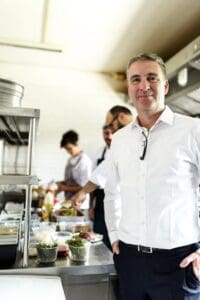 Restaurant,Kitchen,Chef,With,Staff,And,Manager