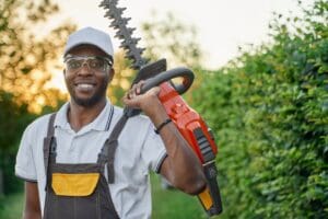 Portrait,Of,Smiling,African,Man,In,Protective,Glasses,And,White