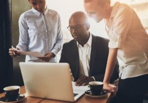 Ethnic,Business,People,,Entrepreneurs,Working,Together,Using,A,Laptop