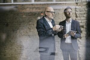 Senior and mid adult businessman having a meeting