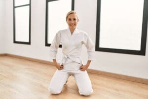 Young,Caucasian,Woman,Smiling,Confident,Training,Karate,At,Sport,Center
