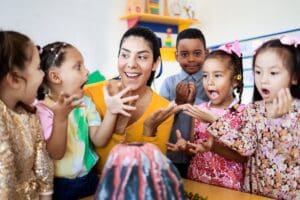 Teacher,And,Group,Of,Children,Learning,About,Volcanos,At,Science