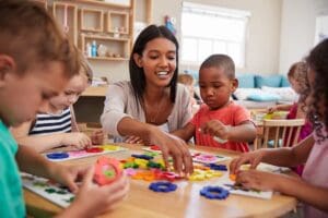 Teacher,And,Pupils,Using,Flower,Shapes,In,Montessori,School