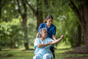 elderly woman seated in a wheelchair with young ca 2025 03 16 20 11 10 utc