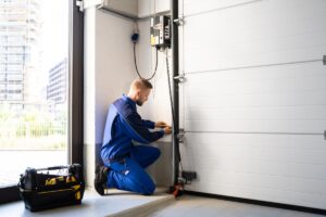 Garage,Door,Installation,And,Repair,At,Home.,Contractor,Man,In
