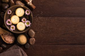 Top,View,Of,Candles,With,Salt,And,Pebbles,On,Wooden