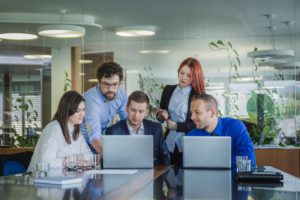 people with laptops office