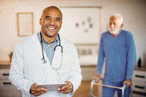 OneMed Solutions happy black doctor using touchpad at nursing home 2024 12 13 21 13 53 utc min 768x512